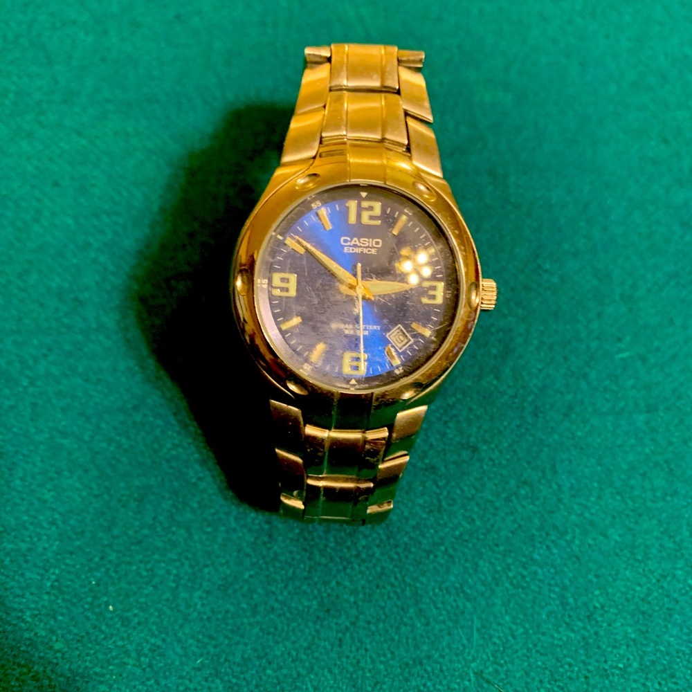 Casio Mens silver watch, blue face background. May need a battery